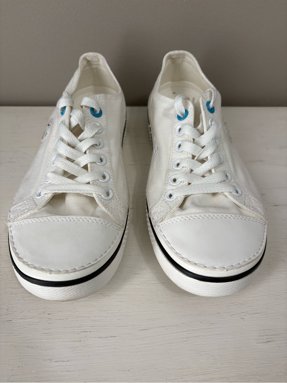 CROCS White Low-Top Canvas Sneakers with Black Stripe and Blue Eyelets